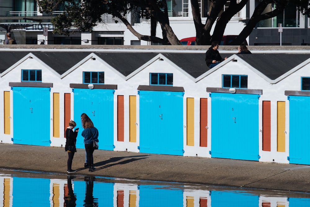 woman standing near houses