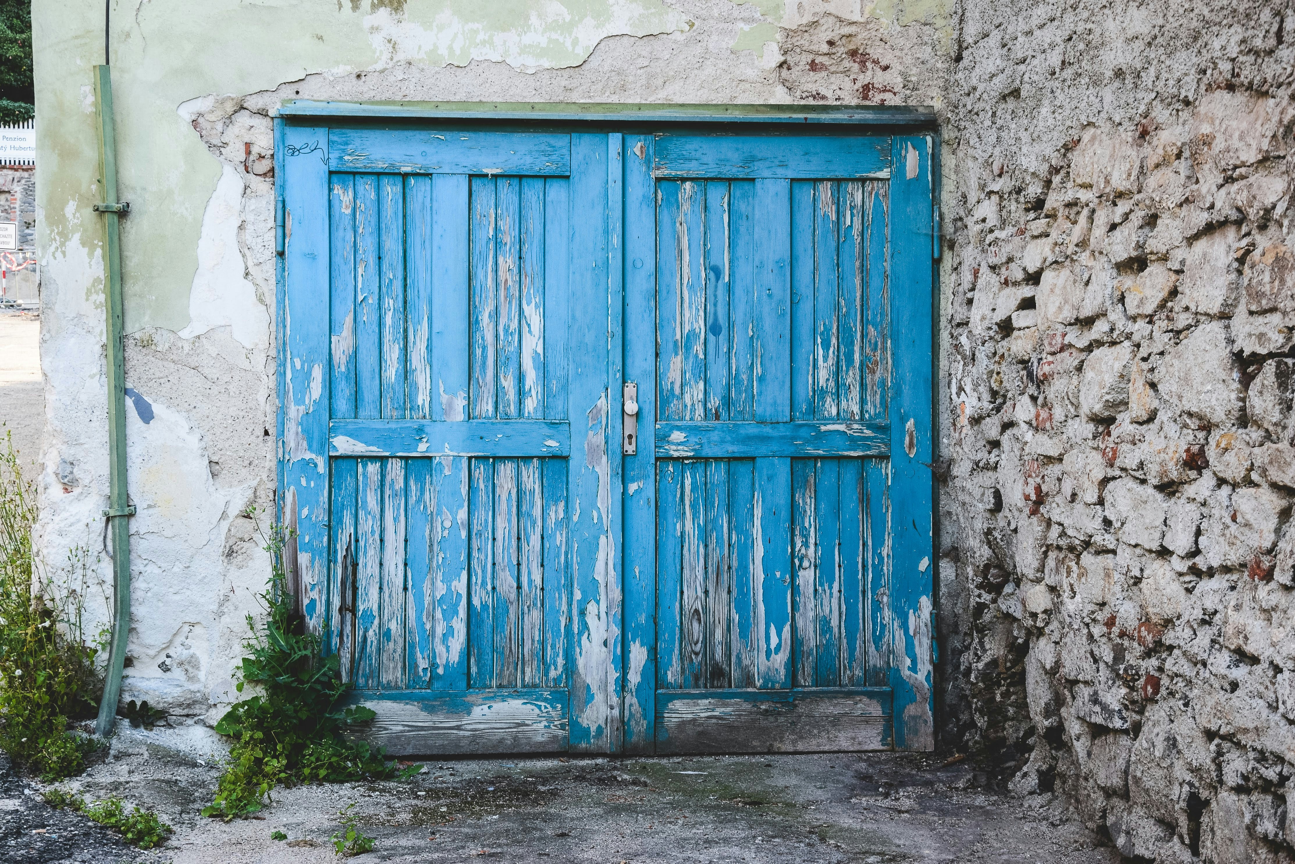 blue wooden panel doors closed, 