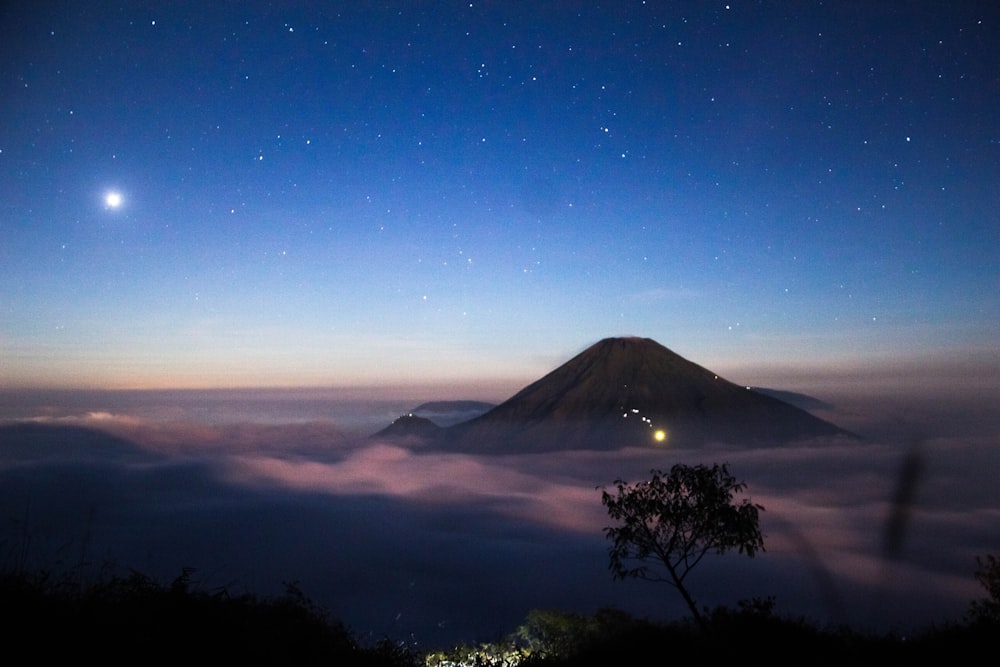 mountain covered by clouds