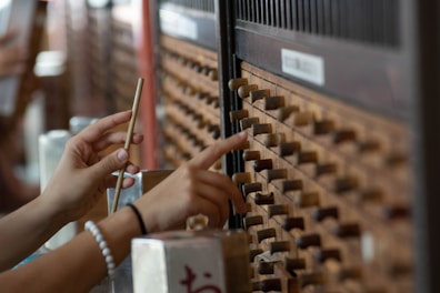 Close-up of a hand picking a product from a curated selection box