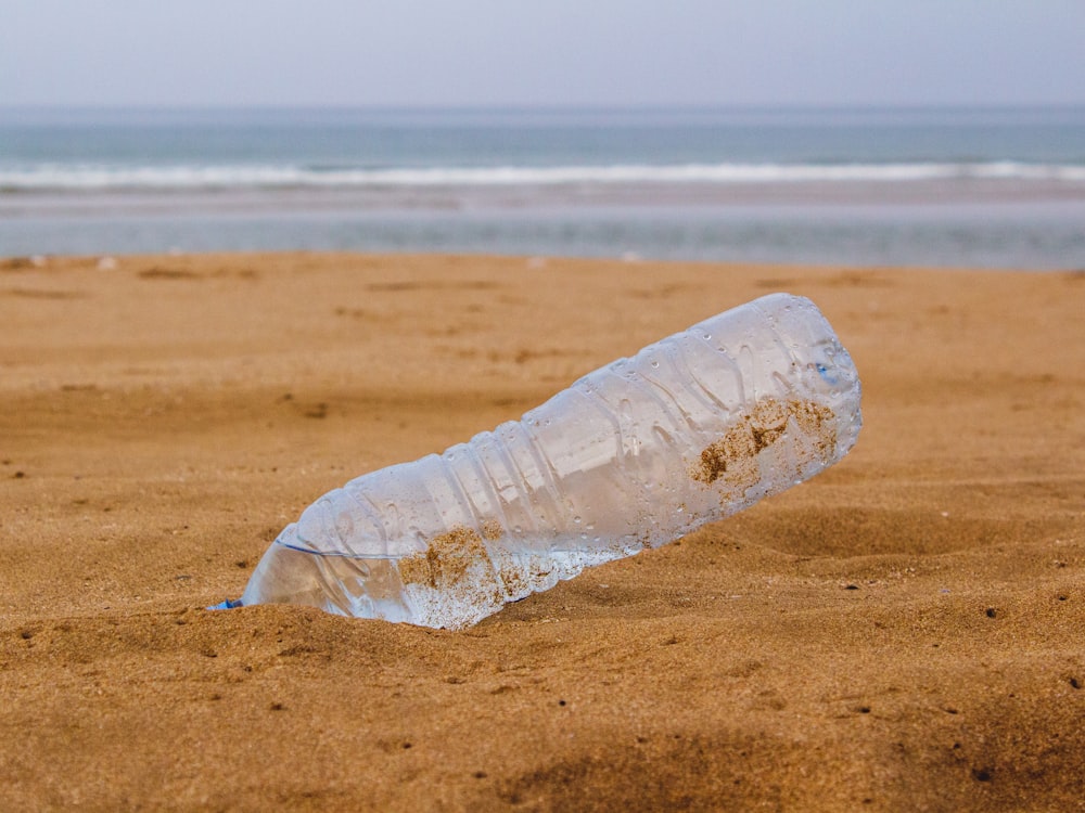 clear bottled water on beach