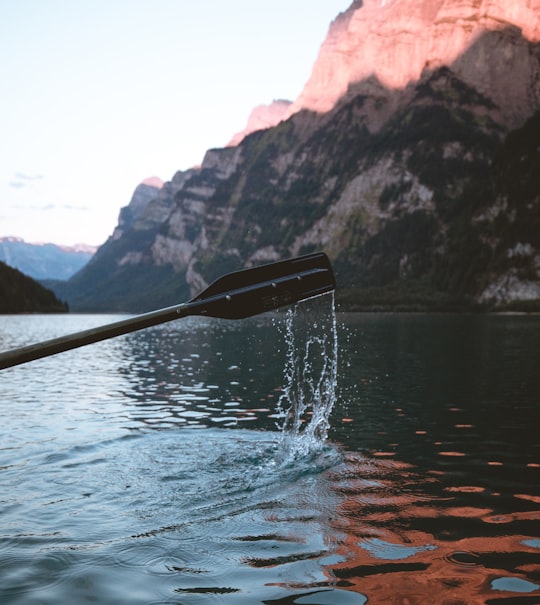 brown wooden paddle in Klöntalersee Switzerland