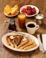 food photography of strawberries, oranges, and pancakes on plates