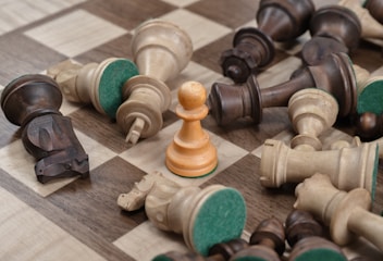 closeup photo of gray and brown chess board set