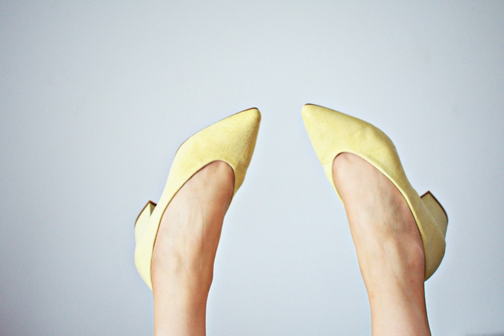pair of yellow leather pointed-toe chunky heeled shoes