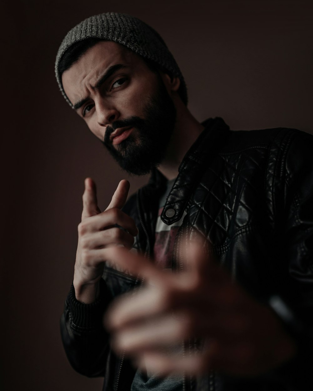 man in black leather jacket taking selfie