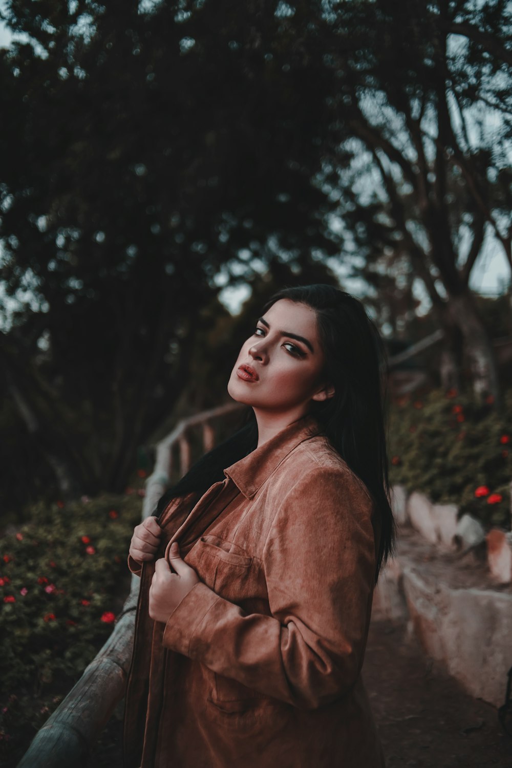 woman wearing brown leather coat