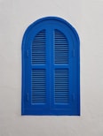 blue wooden window on wall