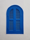 blue wooden window on wall