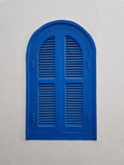 blue wooden window on wall