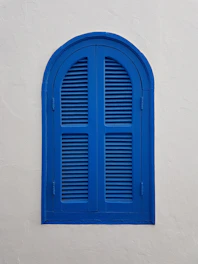 blue wooden window on wall