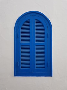 blue wooden window on wall