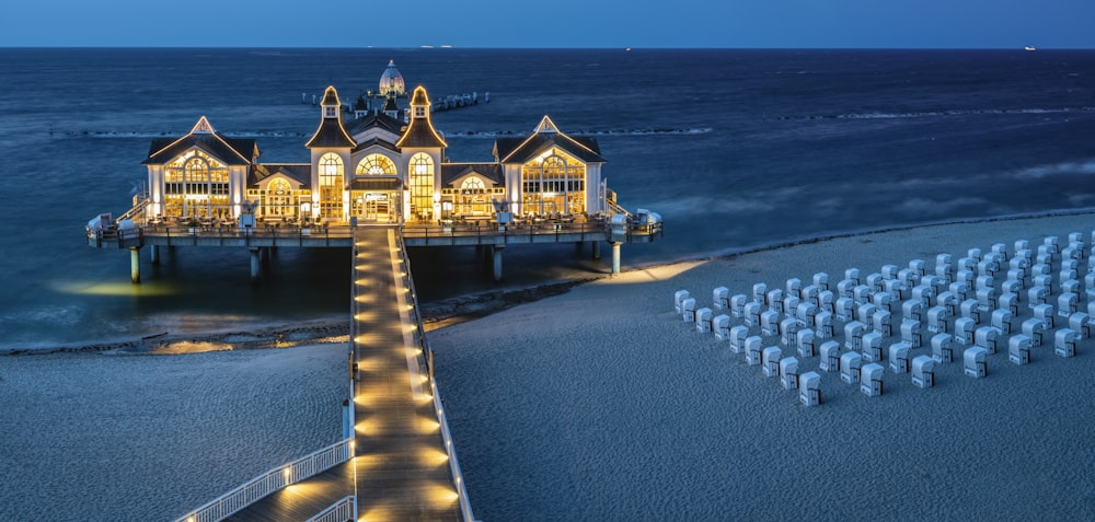 lighted house in body of water