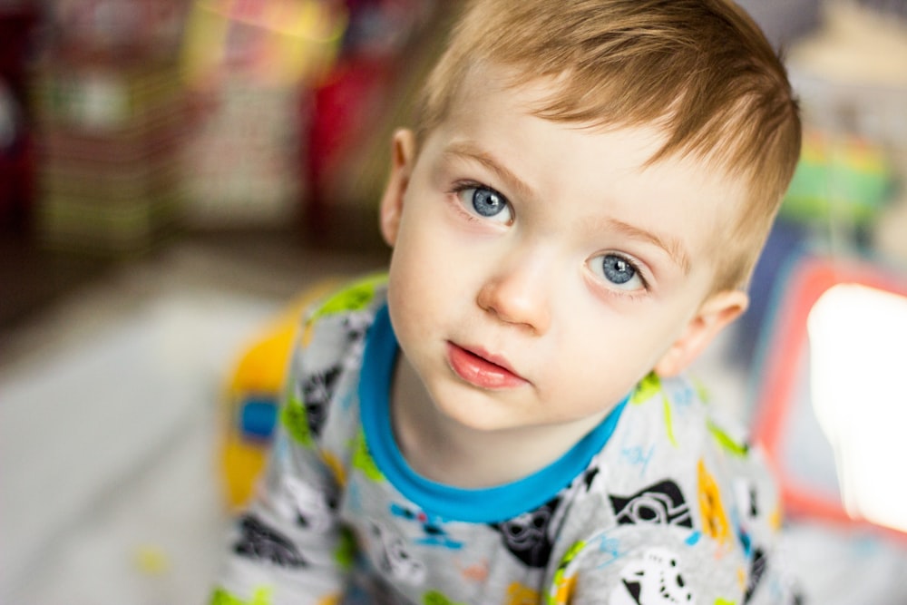 boy in white and black sweat shirt