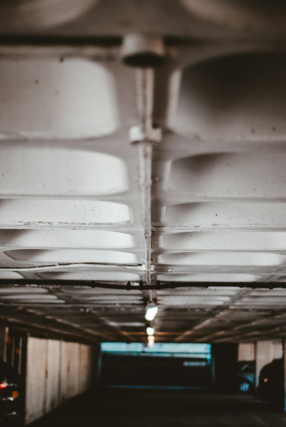 a parking garage filled with lots of white objects