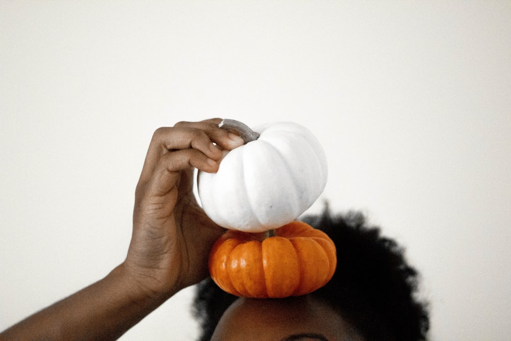 two white-and-orange pumpkins