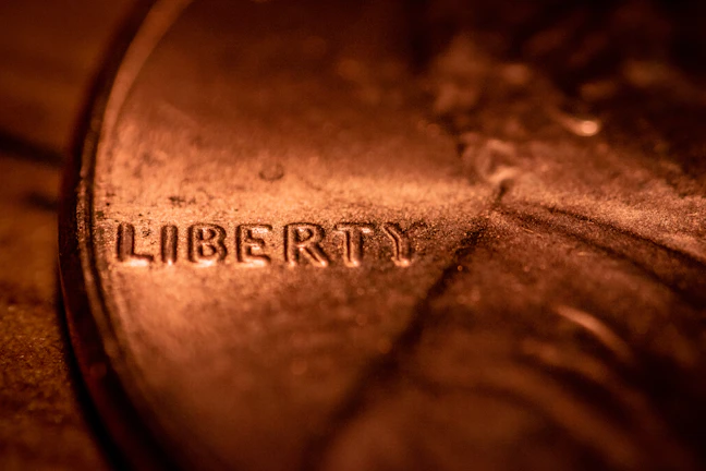 Close-up of a shiny 1909 Lincoln Wheat Penny showing fine details.