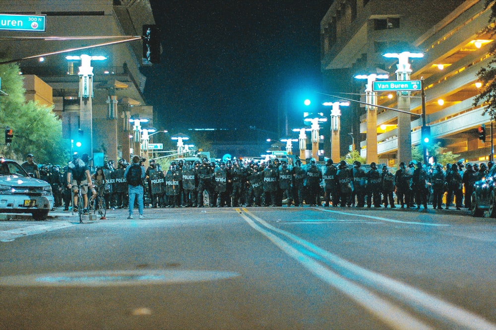 crowd on road during night time