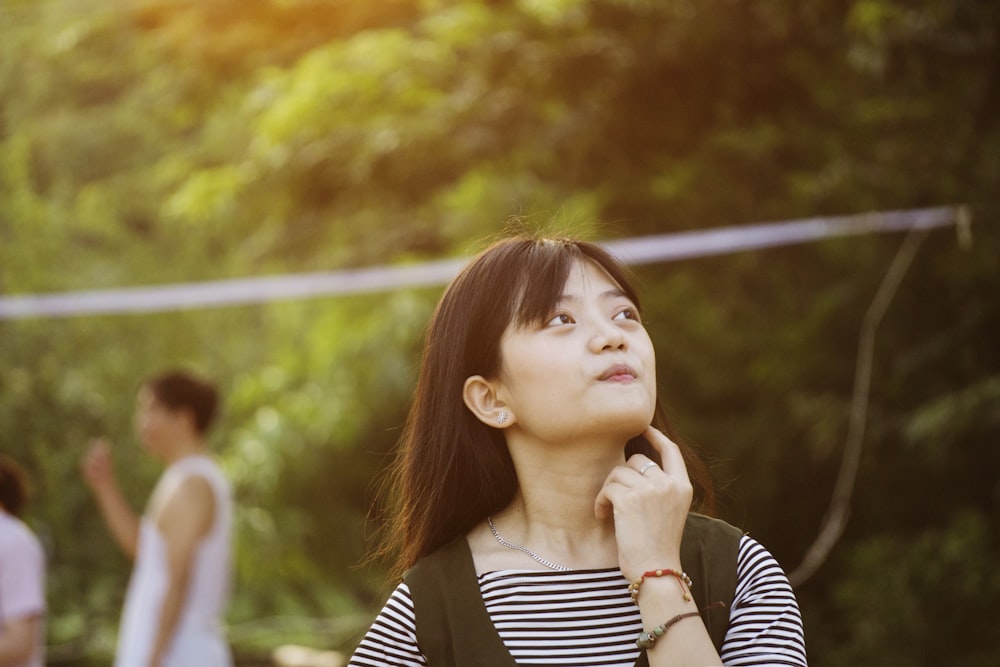 woman wearing white and black striped shirt