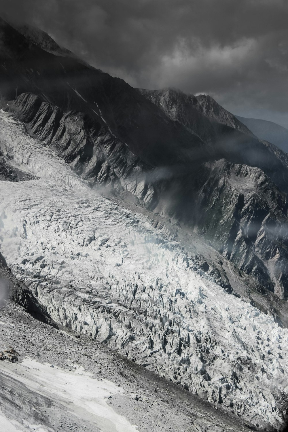 a black and white photo of a mountain range