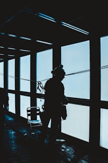 silhouette of woman standing inside room