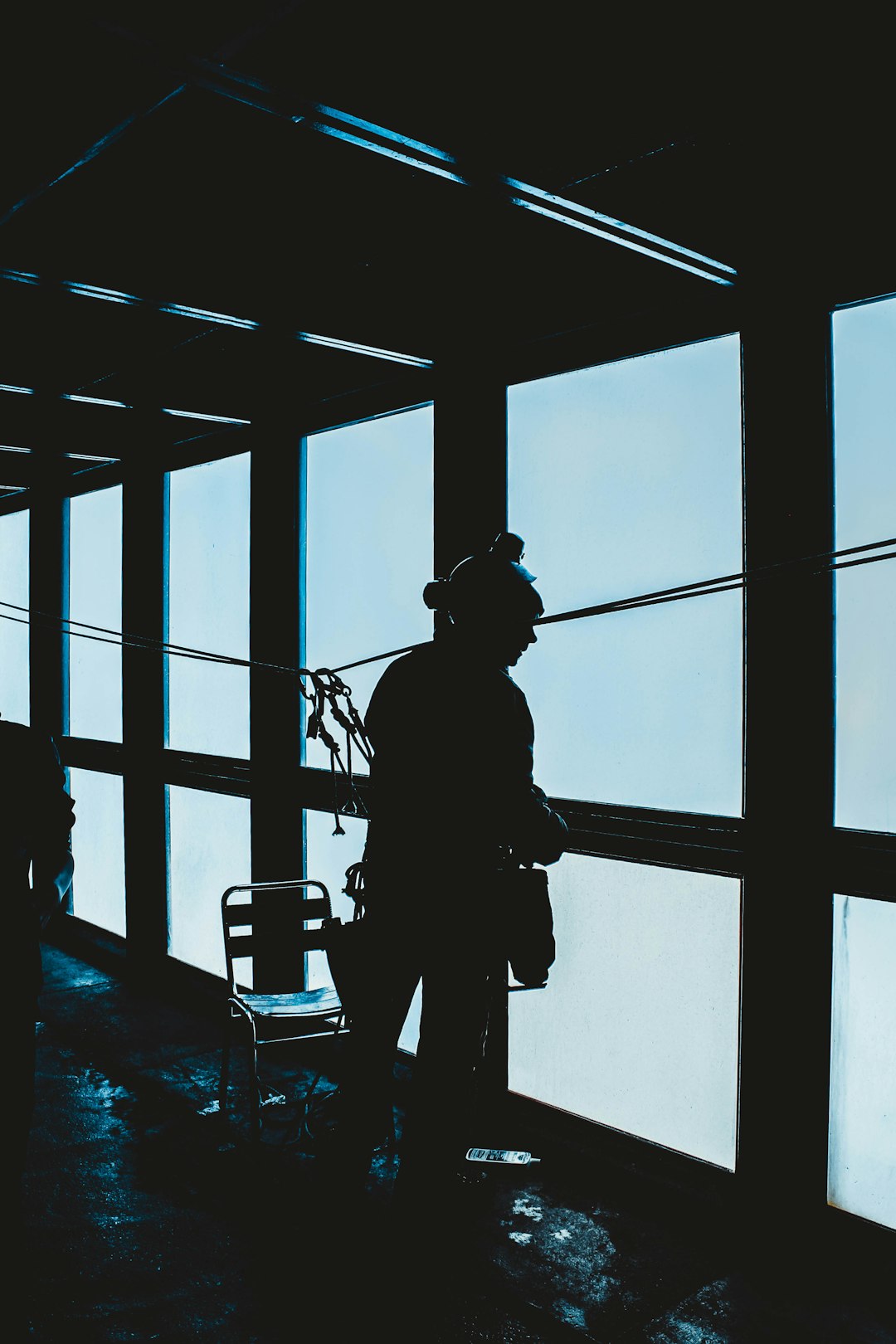 silhouette of woman standing inside room