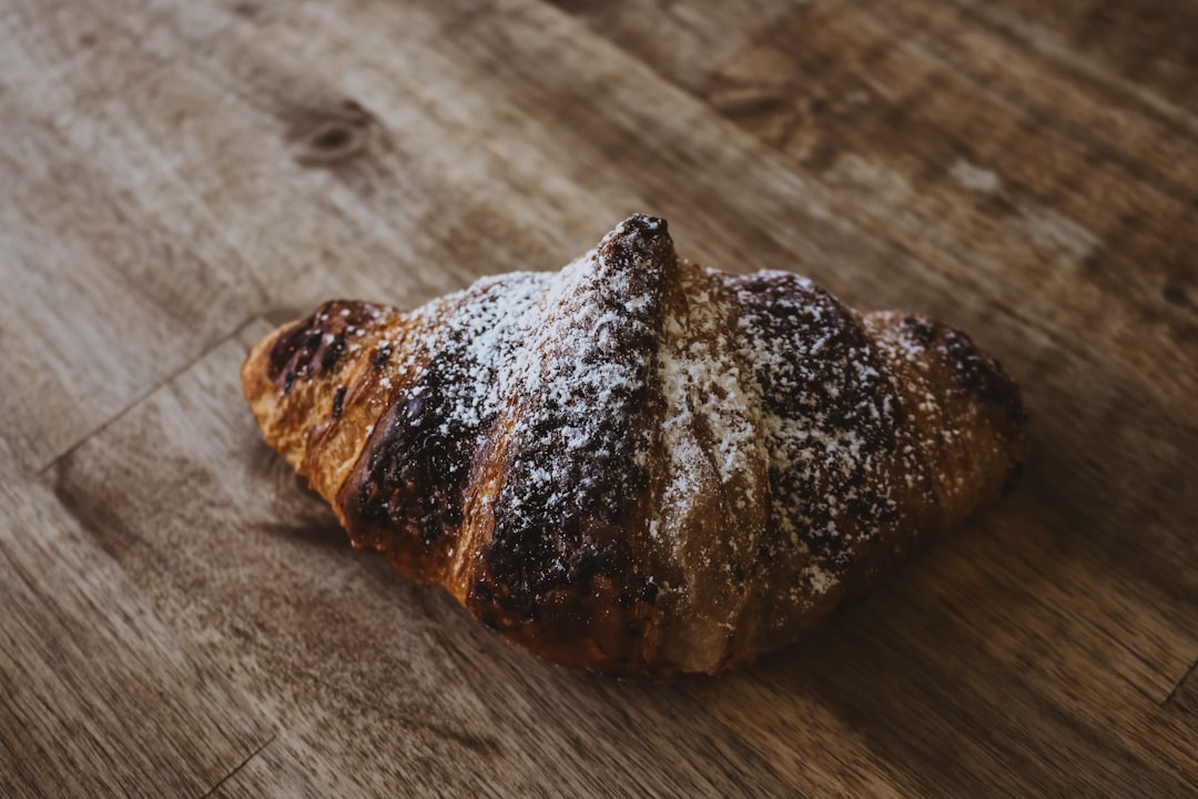 baked bread on brown wooden surface