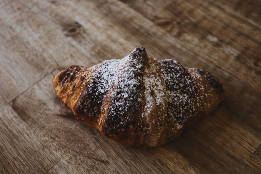 baked bread on brown wooden surface