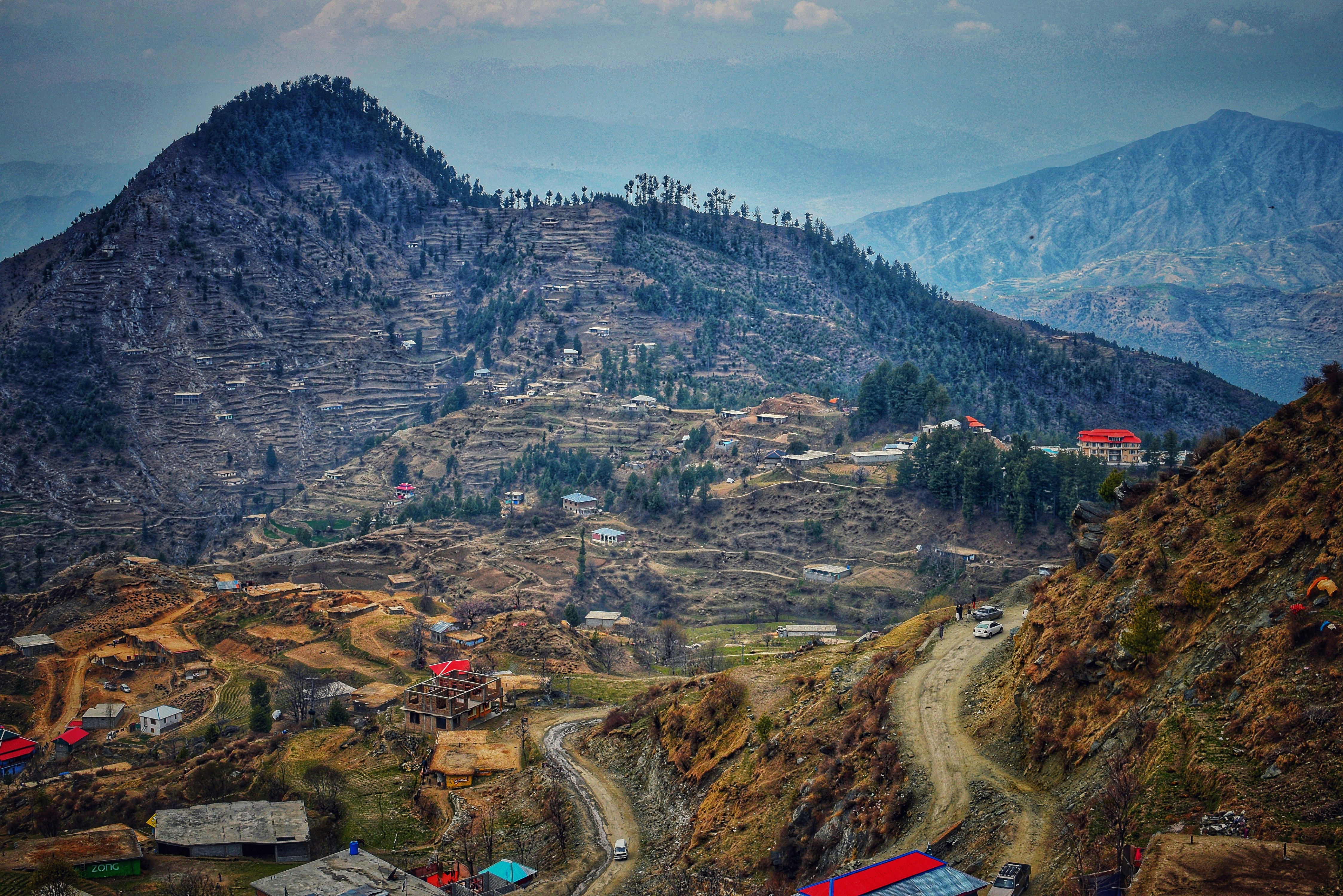 aerial photo of mountain roads during daytime pakistan teams background