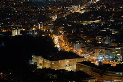 Night view of Rio Vermelho with colorful lights and lively streets.