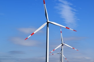 white and red 3-blade windmills during daytime