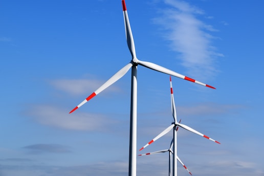 white and red 3-blade windmills during daytime