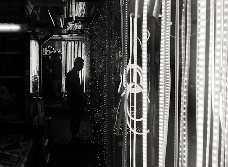 A dark, empty alley illuminated by soft ambient light, symbolizing a sleek social media approach.