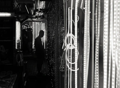 Close-up of the main character in a neon-lit alley, styled with retro comic book shading.