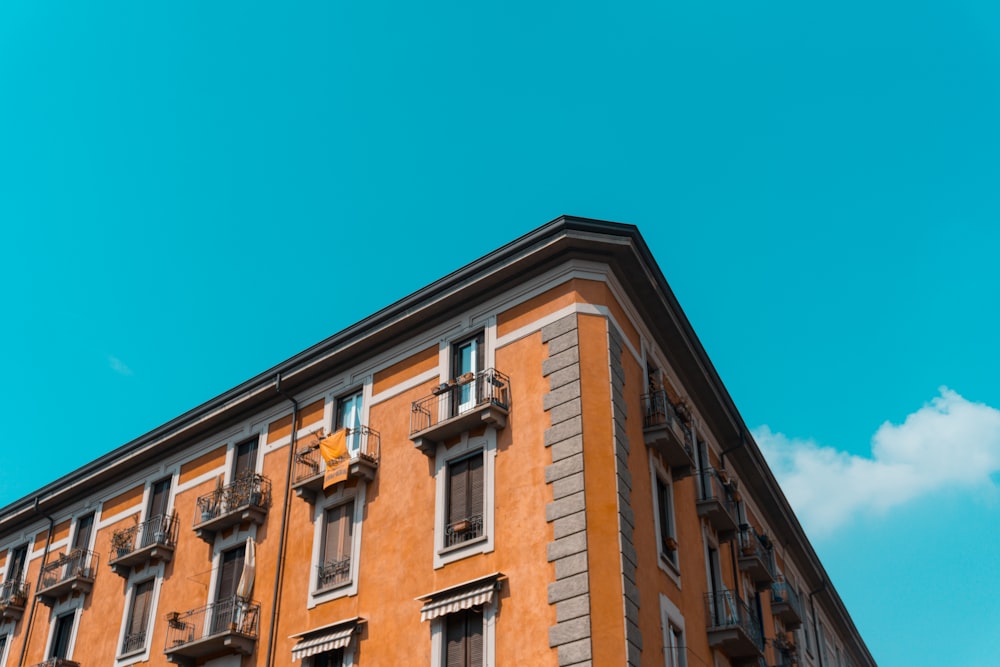 brown concrete building under blue sky