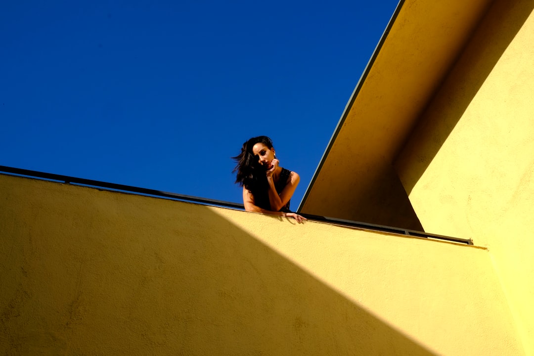woman standing on rooftop during daytime