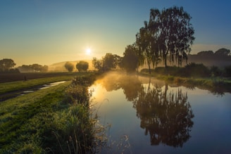 A serene morning scene with a man enjoying a peaceful moment outdoors