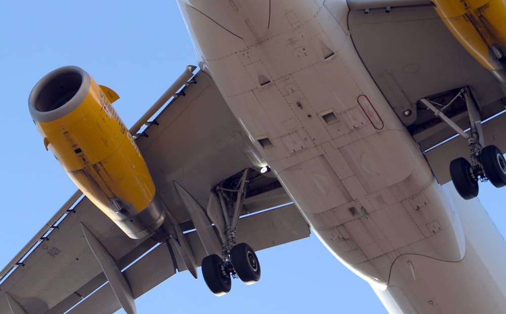 gray flying airplane during daytime