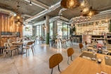 brown wooden tables and chairs inside building