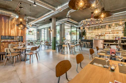 brown wooden tables and chairs inside building