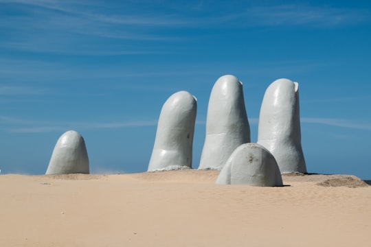 gray human finger statue in Punta del Este Uruguay