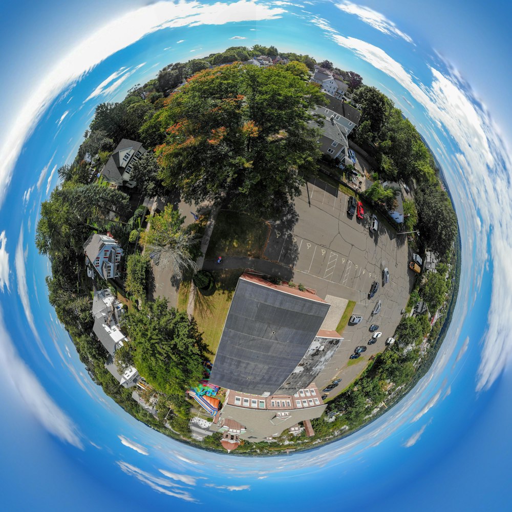 aerial photo of building with parking lot in little planet photography