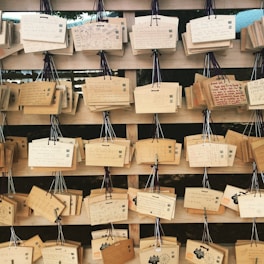 A selection of handcrafted wooden plaques displayed on a rustic table.