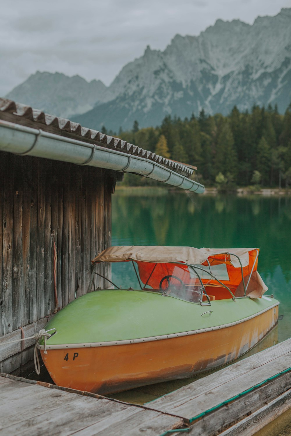 powerboat near of wooden house