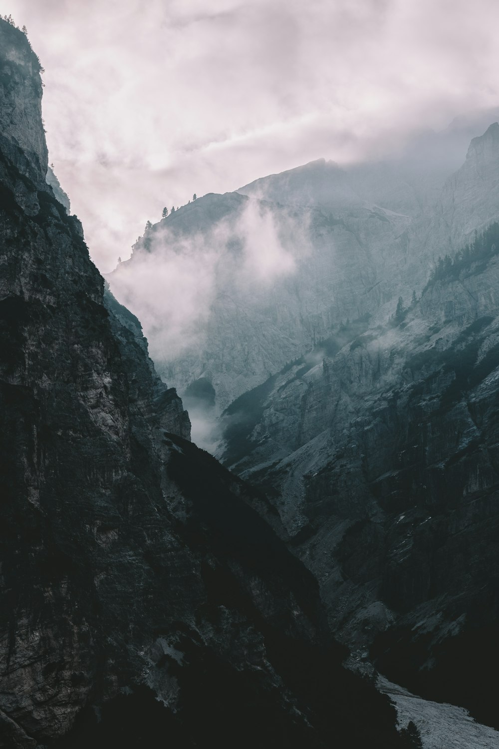 black foggy mountain during daytime