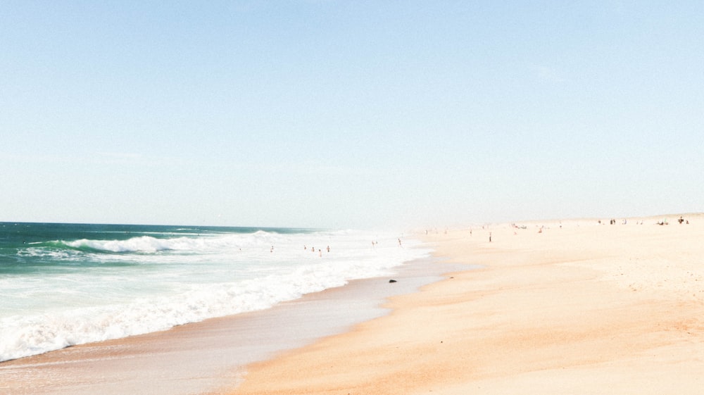 blue ocean under clear blue sky