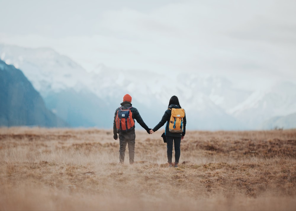 two person standing on grass