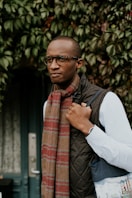 man carrying bag outdoors