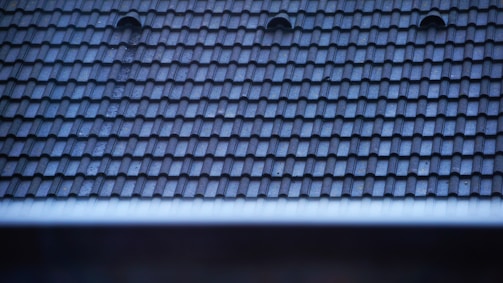 a close up of a roof with two holes in it