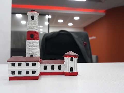 Photo of a Lighthouse Atlantic consultant discussing strategy with a European precision engineering client in a modern office.